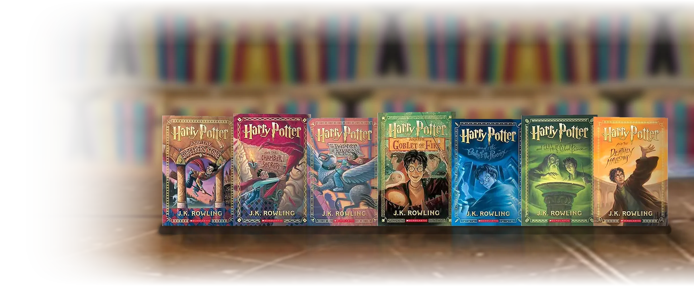 The complete seven-book Harry Potter set standing upright on a wooden table.